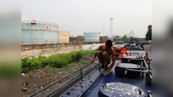 Indian refiners may reduce oil imports to mitigate pain of high crude prices and declining rupee