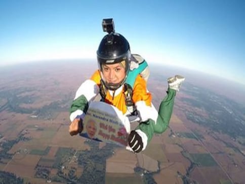 Parajumper Shital Mahajan skydives from 13,000 feet holding placard wishing Narendra Modi on his 68th birthday Parajumper Shital Mahajan skydives from 13,000 feet holding placard wishing Narendra Modi on his 68th birthday