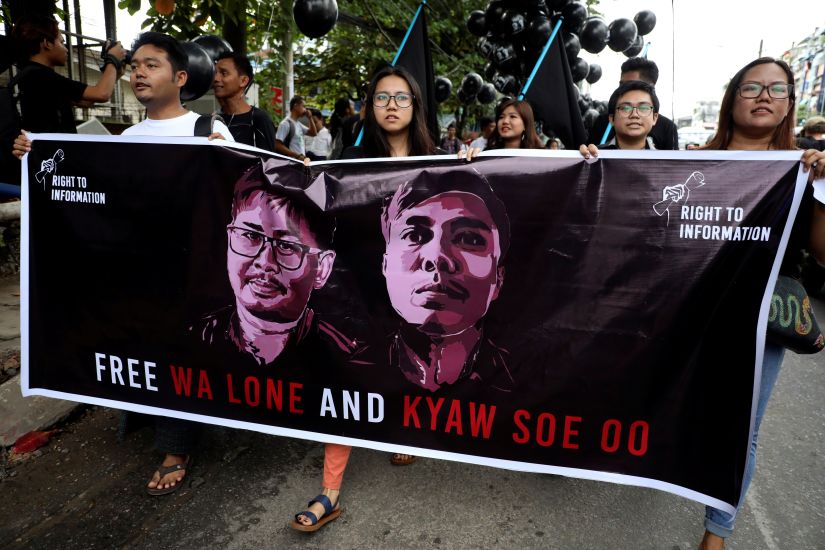 People march to show solidarity for jailed Reuters journalists Wa Lone and Kyaw Soe Oo in Yangon. Reuters