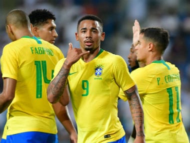 Brazil's Gabriel Jesus celebrates scoring their first goal with team mates. Reuters