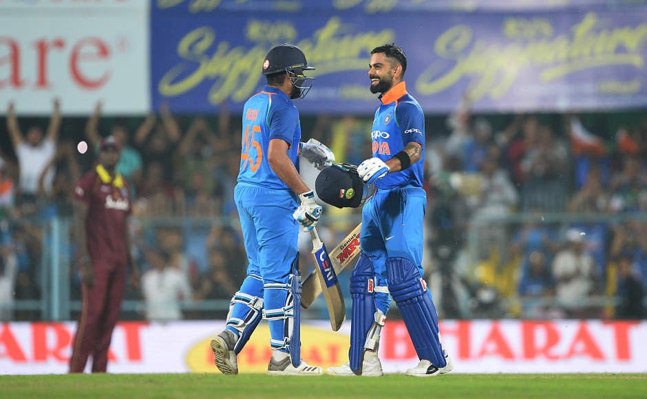 Virat Kohli and Rohit Sharma formed a 246-run partnership for the second wicket, which made matters easy for the hosts as they cruised to eight-wicket victory against the West Indians, chasing down the 323 run-target in just 42.1 overs. AFP Virat Kohli and Rohit Sharma formed a 246-run partnership for the second wicket, which made matters easy for the hosts as they cruised to eight-wicket victory against the West Indians, chasing down the 323 run-target in just 42.1 overs. AFP