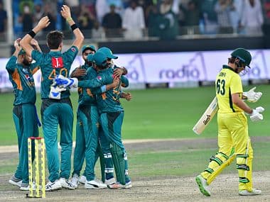 Pakistan cricketers celebrate after victory in the second T20 cricket match between Pakistan and Australia at The International Cricket Stadium in Dubai on October 26, 2018. (Photo by GIUSEPPE CACACE / AFP)