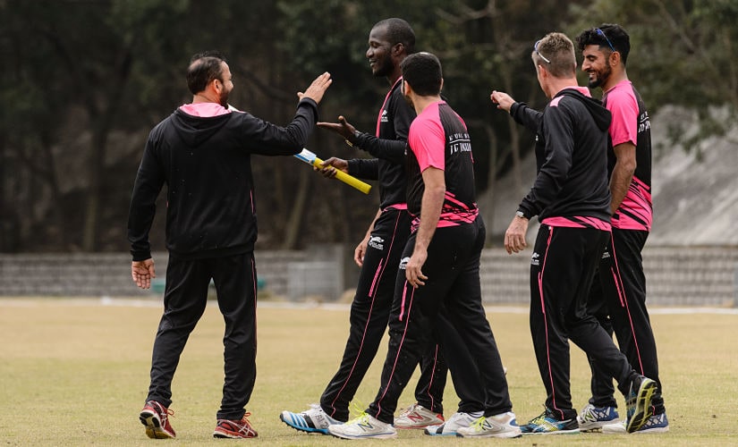 In this photo taken on March 7, 2017, West Indies cricketer Darren Sammy (2nd L), who is playing with local team Hung Hom JD Jaguars at the 2017 DTC Hong Kong T20 Blitz cricket tournament, leaves the pitch with teammates after a training session in Hong Kong. - Foreign players have tentatively endorsed the return of international cricket to Pakistan after their whirlwind trip to Lahore for Sunday's heavily guarded Pakistan Super League final. (Photo by Anthony WALLACE / AFP)