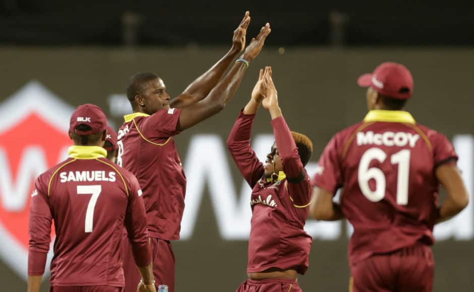 Jason Holder celebrates the dismissal of India wicket-keeper-batsman MS Dhoni. AP