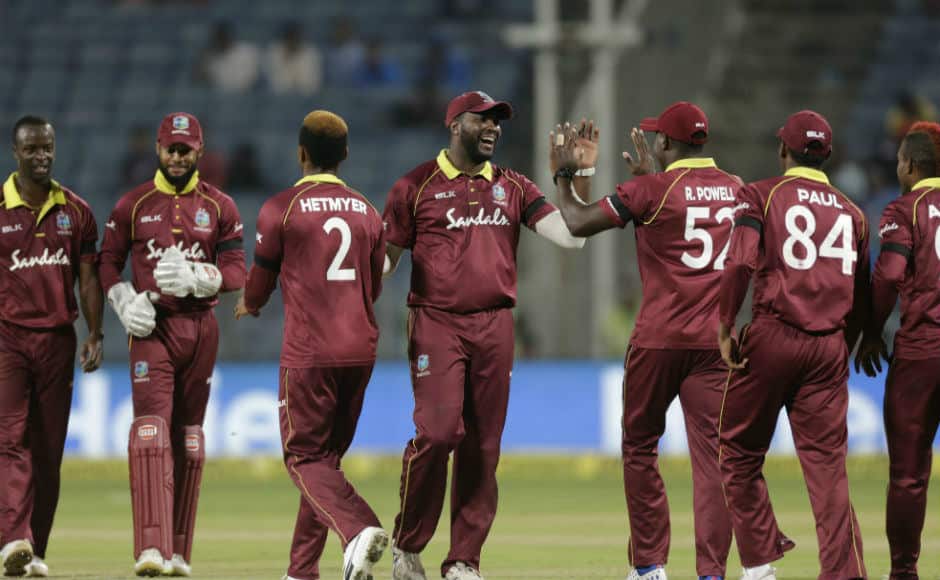 West Indies players shake hands with each other after pulling off a series-levelling 43-run victory at Pune. AP