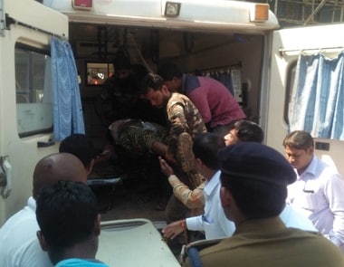 Security personnel bring the injured to the hospital. News18