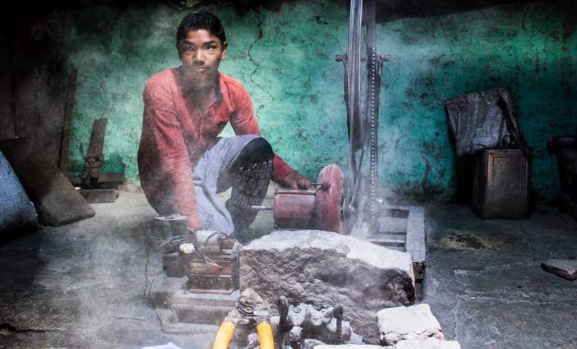 Rajendra’s youngest son, Omkar who is grade IX displaying his father’s innovation in which he redesigned the traditional coal forge