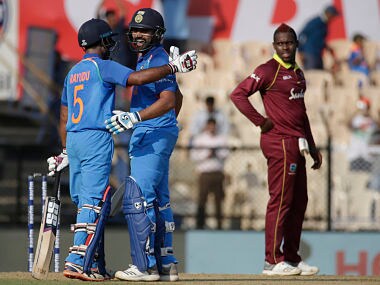 India’s Rohit Sharma, second from left, celebrate scoring a century with his team player Ambati Rayudu, left, during the fourth one-day international cricket match between India and West Indies in Mumbai, India, Monday, Oct. 29, 2018. (AP Photo/Rafiq Maqbool)