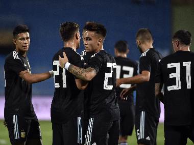 Argentina's Lautaro Martinez (centre) celebrates his goal with teammates. AFP