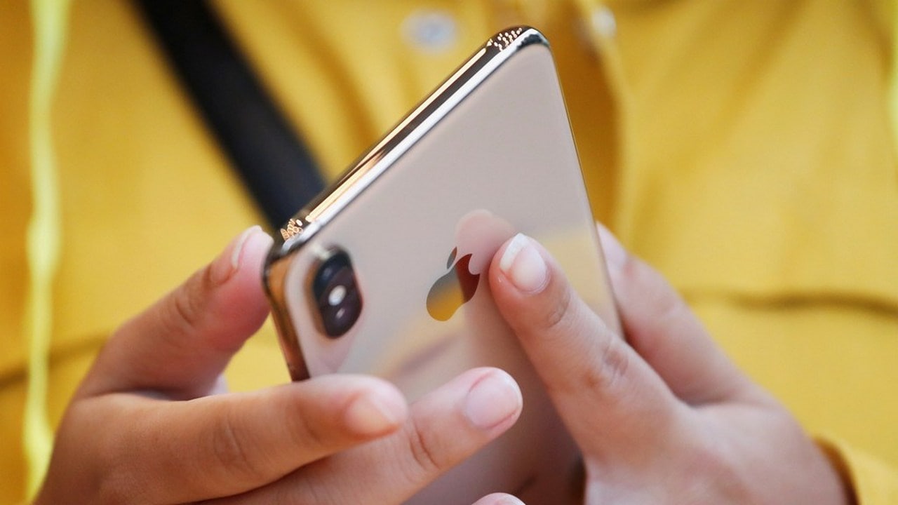 A customer looks at Apple's new iPhone XS. Image: Reuters