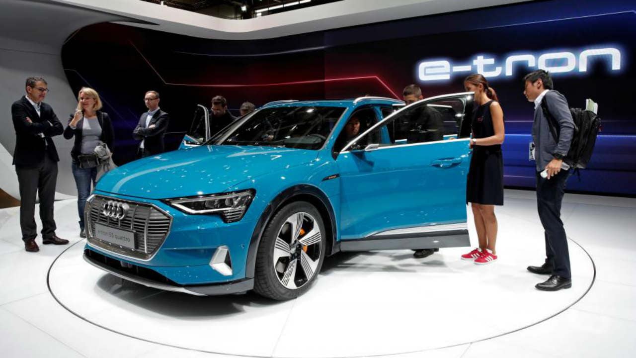 People inspect the Audi E-Tron 5S Quattro during the first press day at the Paris auto show, Paris, France, October 2, 2018. REUTERS/Benoit Tessier/File Photo