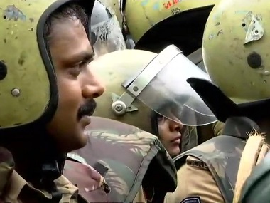 Sabarimala row: Two women, including Hyderabad reporter, begin trek to shrine with police protection amid strong protests Sabarimala row: Two women, including Hyderabad reporter, begin trek to shrine with police protection amid strong protests