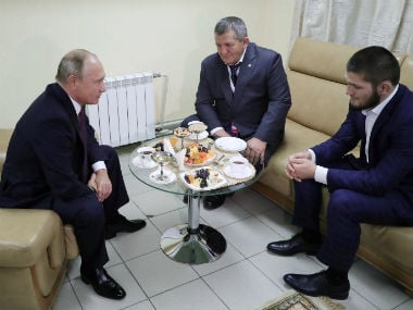 Russian President Vladimir Putin (L) meets with mixed martial arts fighter Khabib Nurmagomedov of Russia (R), UFC lightweight champion who recently defeated Conor McGregor. Reuters