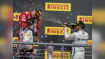 United States Grand Prix: Kimi Raikkonen wins first race in five years as Lewis Hamilton waits for fifth world title after finishing third
