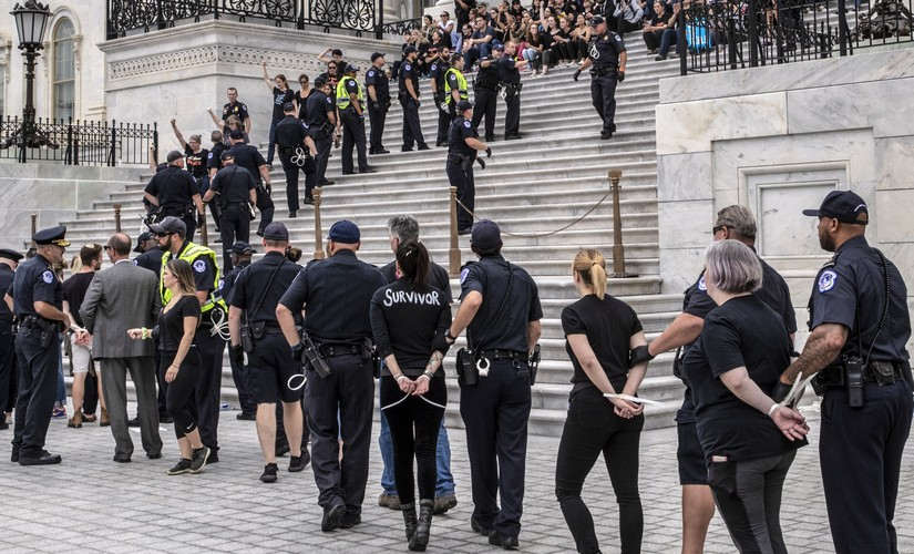 Police arrested those protesting against Brett Kavanaugh's appointment as US Supreme Court justice. AP