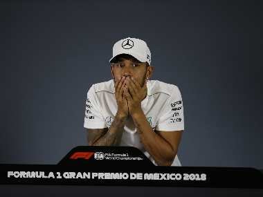 Mercedes' Lewis Hamilton reacts during a press conference after he crowned himself Formula One champion on Sunday. AP Photo