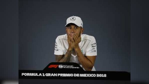 Mexican Grand Prix: Lewis Hamilton joins Juan Manuel Fangio in history books with 'surreal' fifth world championship