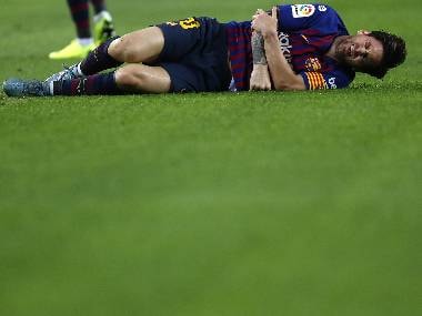 Barcelona's Lionel Messi injures his arm during the LaLiga match against Sevilla at the Camp Nou. AP Photo