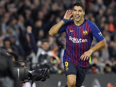 Barcelona's Luis Suarez celebrates a goal against Real Madrid. AFP