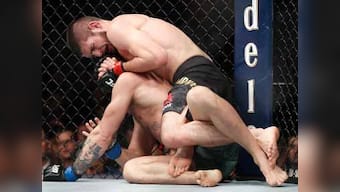 UFC 229: Khabib Nurmagomedov defends lightweight belt as Conor McGregor taps out in chaotic finale
