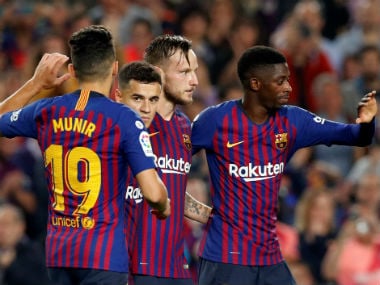 Barcelona's Ivan Rakitic celebrates scoring their fourth goal with tea mates against Sevilla last week. Reuters