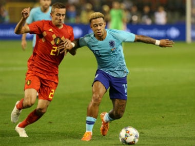 Netherlands' Memphis Depay in action with Belgium's Timothy Castagne. Reuters