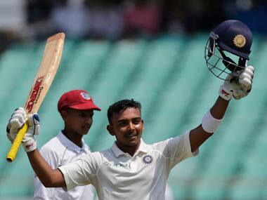 Indian cricketer Prithvi Shaw celebrates his century during the first day of the first Test against Windies in Rajkot. AP 