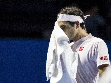Roger Federer reacts during the quarter-final match against Gilles Simon. AP Photos