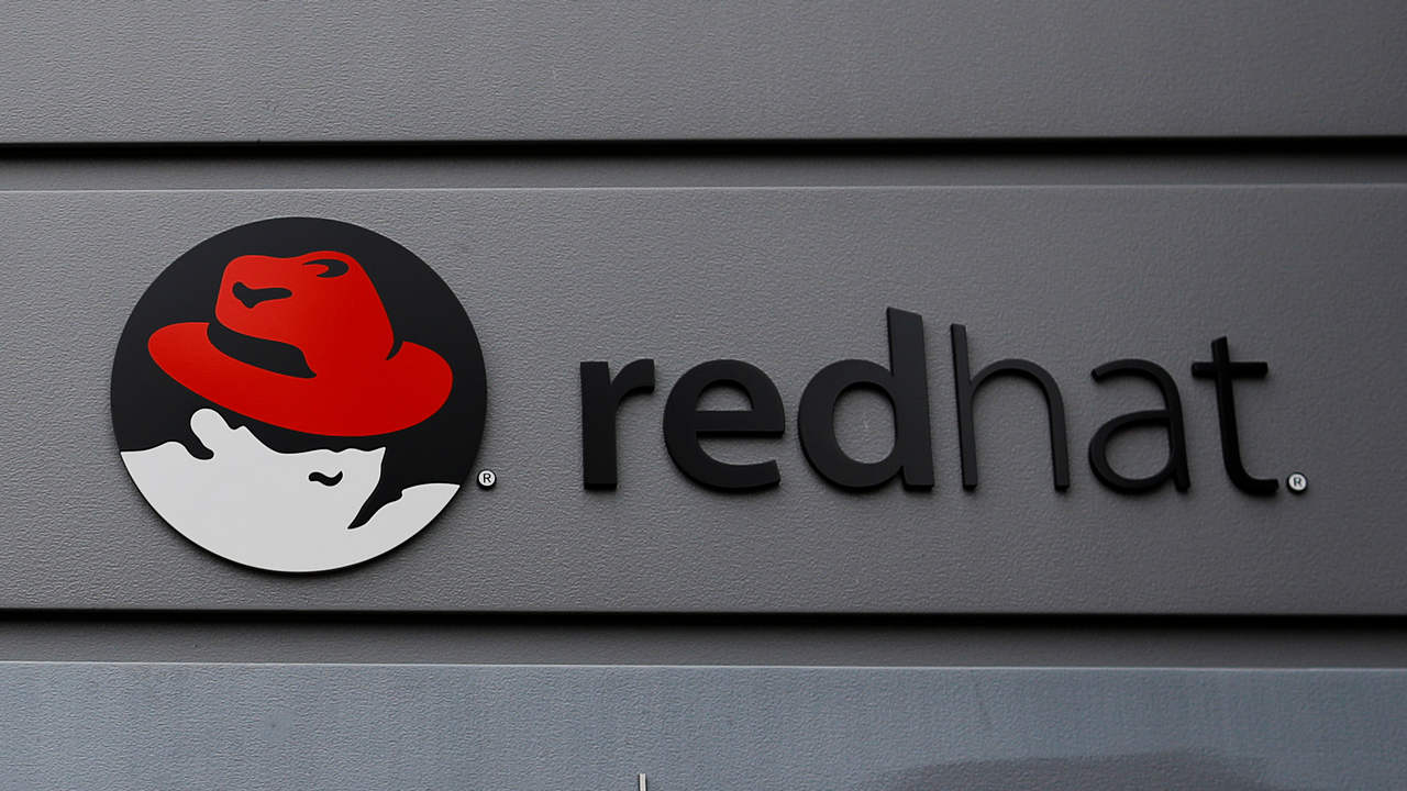 A sign for Red Hat hangs on a building in Boston, Massachusetts, US. Image: Reuters