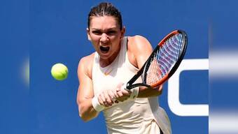 Simona Halep pleased by No 1 ranking but wary of exacerbating back injury by playing in WTA Finals
