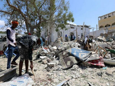 Double suicide blast in Somalia kills 14, injures 20; militant group Al Shabaab claims responsibility for attack Double suicide blast in Somalia kills 14, injures 20; militant group Al Shabaab claims responsibility for attack