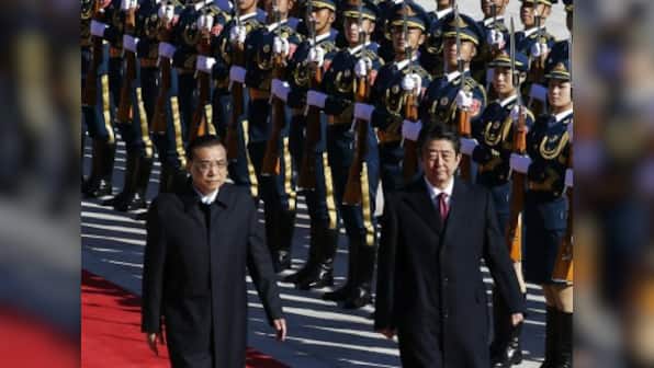 Shinzo Abe welcomed by Li Keqiang near Tiananmen Square; PM's rare China visit comes days before Modi arrives in Japan