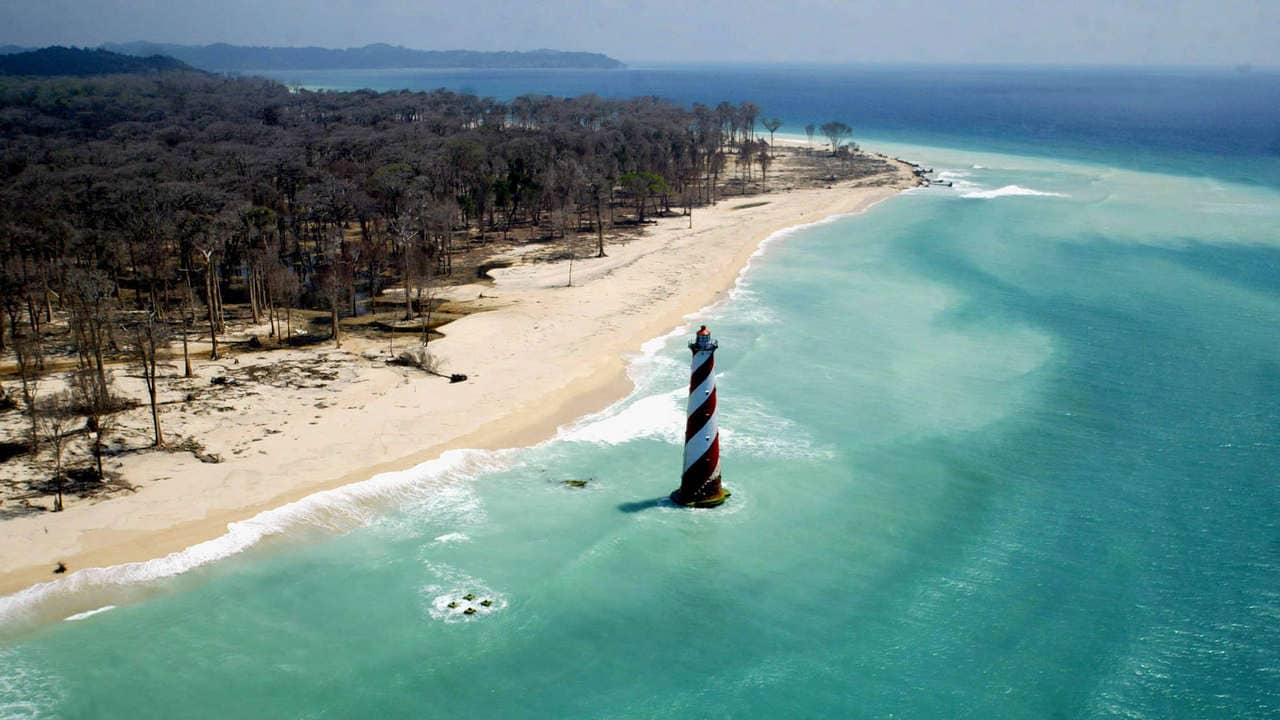 An aerial view of the damaged coast of Indira Point, India's southern most point, 600 km (about 375 miles) south of Port Blair, in the Andaman and Nicobar archipelago March 1, 2005. The tsunami which swamped Asian coastlines just over two months ago not only killed thousands of people in India's Andaman and Nicobar islands, it also hurt a vital part of the country's defences. Picture taken on March 1, 2005. REUTERS/Sucheta Das - RP5DRIHIJHAA