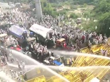 Police halt farmers' march at Delhi-UP border using water cannons, tear gas shells; protesters break barricades Police halt farmers' march at Delhi-UP border using water cannons, tear gas shells; protesters break barricades
