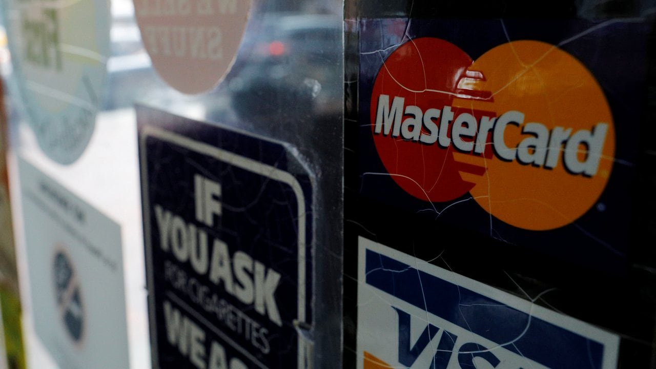A sticker shows that a store accepts MasterCard. Image: Reuters