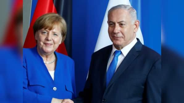 Angela Merkel and Benjamin Netanyahu hold talks to publicly brush aside past differences, promote Germany-Israel cooperation