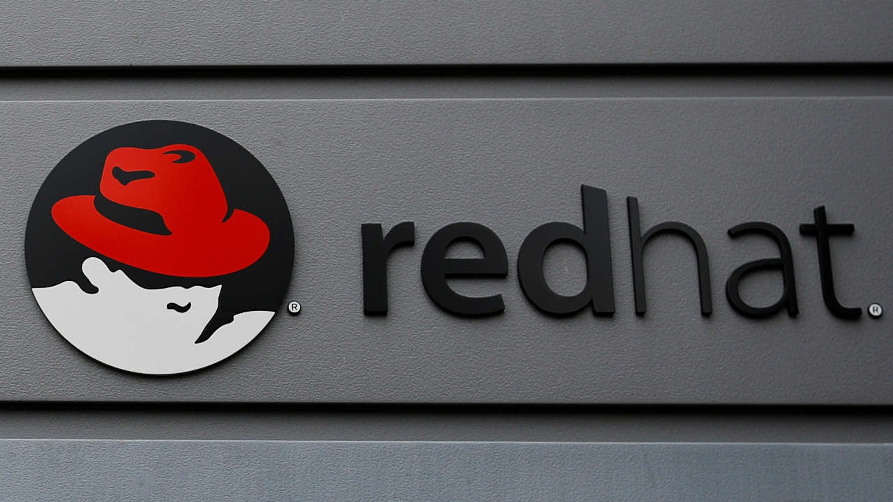 A sign for Red Hat hangs on a building in Boston. Image: Reuters