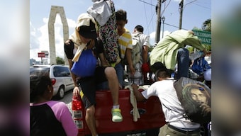 Caravan migrants arrive in Mexico City on way to US border as Donald Trump makes their journey central campaign issue