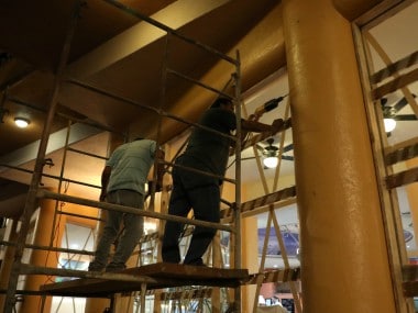 An employee reinforces glass panels of a hotel in Mazatlan, Mexico as precautionary measures for the hurricane. Reuters