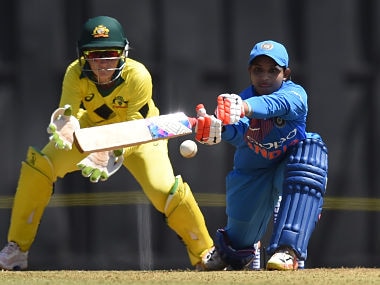 Indian cricketer Anuja Patil (R) plays a shot during the first match of the women's Twenty 20 (T20) Tri-Series between India and Australia at the Brabourne Stadium in Mumbai on March 22, 2018. (Photo by INDRANIL MUKHERJEE / AFP) / ----IMAGE RESTRICTED TO EDITORIAL USE - STRICTLY NO COMMERCIAL USE----- / GETTYOUT