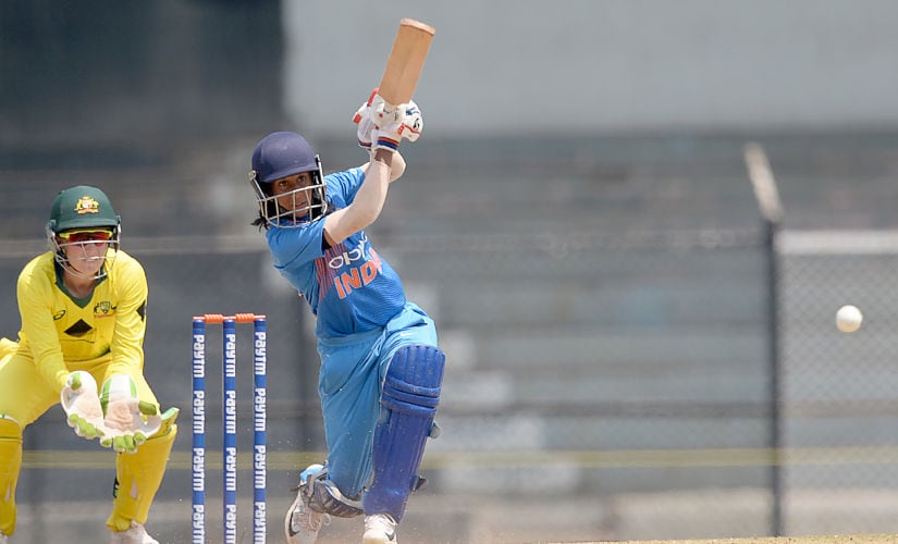 India cricketer Jemimah Rodrigues (R) plays a shot during the fourth cricket match of the women’s Twenty20 (T20) tri-series between India and Australia at Brabourne Stadium in Mumbai on March 26, 2018. (Photo by PUNIT PARANJPE / AFP) / —-IMAGE RESTRICTED TO EDITORIAL USE - STRICTLY NO COMMERCIAL USE—– / GETTYOUT