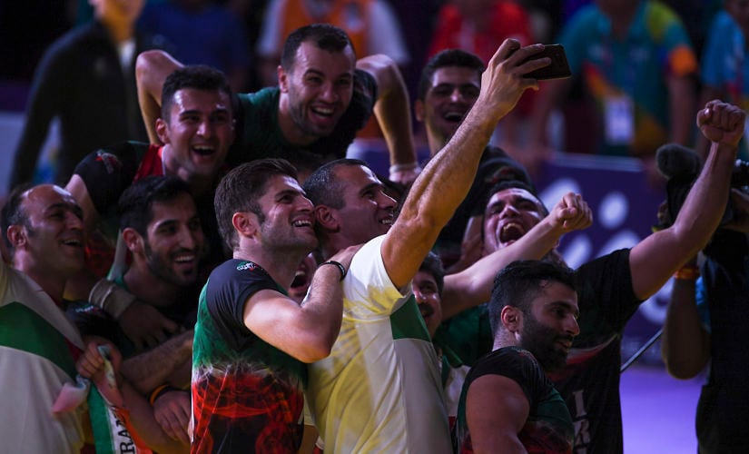 Iran players celebrate during the victory ceremony for the men's kabaddi at the 2018 Asian Games in Jakarta. AFP