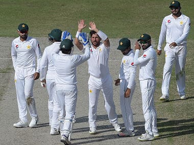 Pakistani spinner Yasir Shah (C) celebrates with teammates after taking the wicket of New Zealand batsman Ish Sodhi during the fourth day of the second Test cricket match between Pakistan and New Zealand at the Dubai International Stadium in Dubai on November 27, 2018. (Photo by AAMIR QURESHI / AFP)