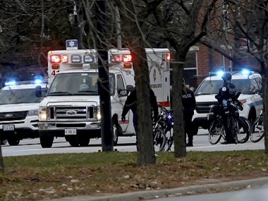Police arrive at Mercy Hospital where a gunman opened fire indiscriminately. AP