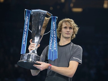 Alexander Zverev of Germany holds the trophy after defeating Novak Djokovic of Serbia in their ATP World Tour Finals singles final tennis match at the O2 Arena in London, Sunday Nov. 18, 2018. (AP Photo/Tim Ireland)