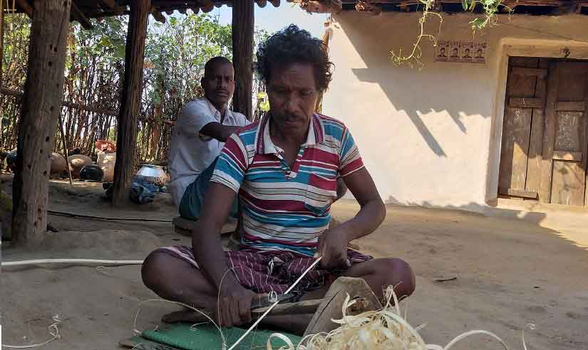 Budhiram making a rice cleaner, which he will sell to the residents of Chhattisgarh's Bankesma village later. Image Courtesy: Natasha Trivedi/Firstpost