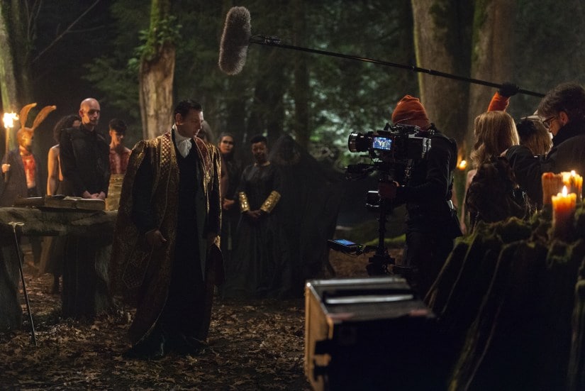 A behind-the-scenes still from Sabrina's dark baptism in the woods. Netflix