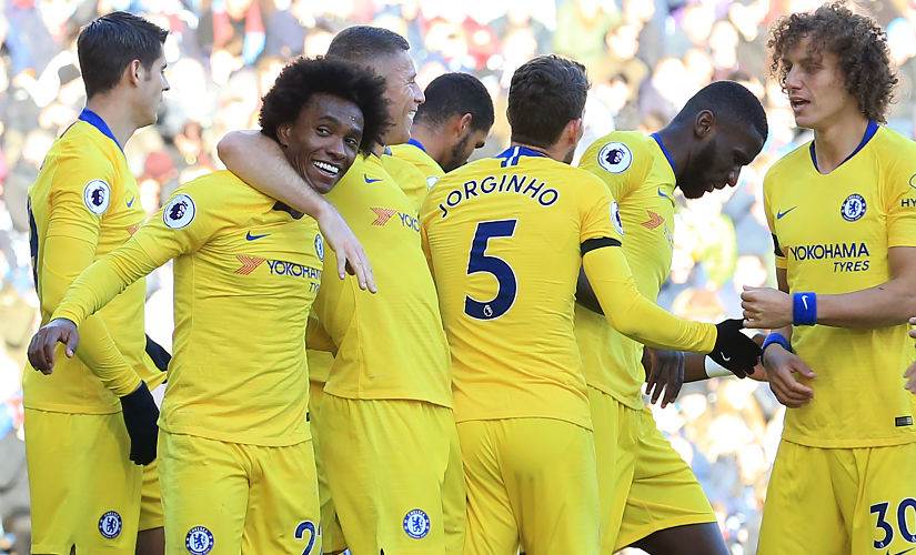 Chelsea players celebrate after scoring against Burnleylast month. AFP