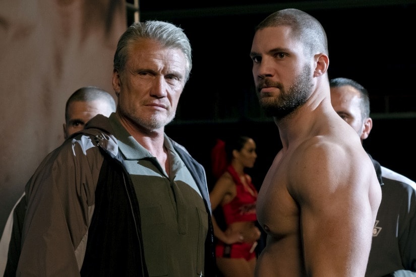 This image released by Metro Goldwyn Mayer Pictures / Warner Bros. Pictures shows Dolph Lundgren, left, and Florian Munteanu in a scene from "Creed II." (Barry Wetcher/Metro Goldwyn Mayer Pictures/Warner Bros. Pictures via AP)