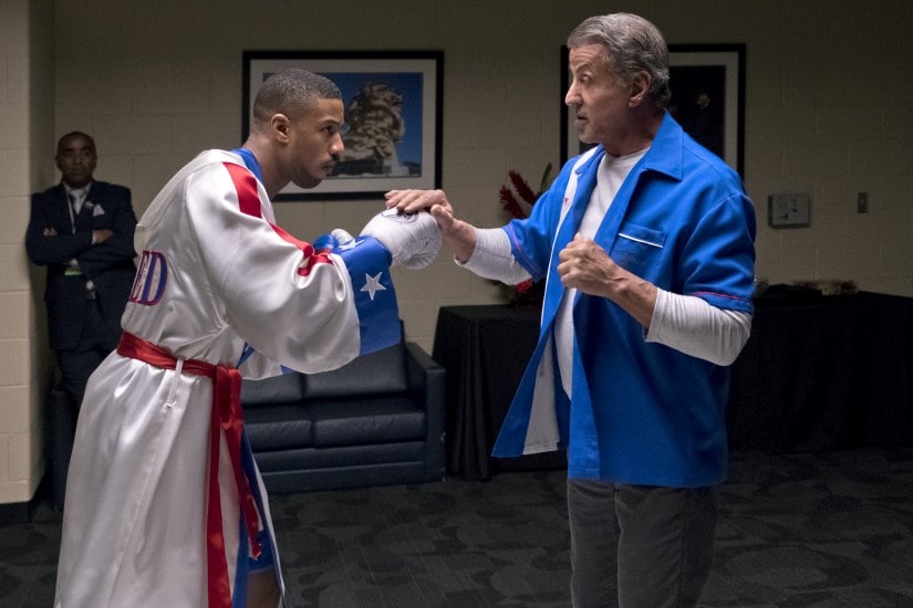 This image released by Metro Goldwyn Mayer Pictures / Warner Bros. Pictures shows Michael B. Jordan, left, and Sylvester Stallone in a scene from "Creed II." (Barry Wetcher/Metro Goldwyn Mayer Pictures/Warner Bros. Pictures via AP)